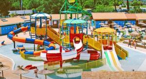 a water park with a colorful water slide at Villa bord de mer in Labenne