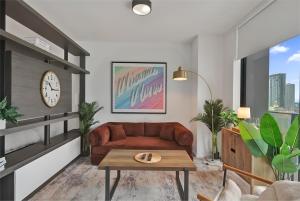 a living room with a couch and a table at Cadenza Miami - Luxury Residences in Miami