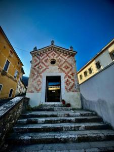 a building with stairs leading up to a door at A Casa di Angelica in Piovene Rocchette