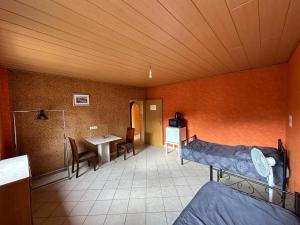 a room with a bed and a table in it at Ruhige Wohnung in Gelsenkirchen in Gelsenkirchen