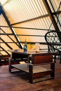 a table and a chair in a room at Casa Monte Bello- Cabaña privada in Huehuetenango