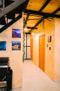 a hallway in an office building with a door at Casa Monte Bello- Cabaña privada in Huehuetenango