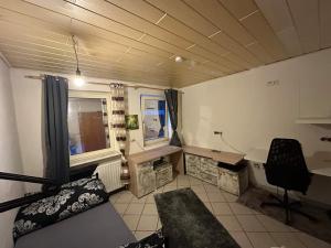 a room with a bed and a desk and a chair at Ruhige Wohnung in Gelsenkirchen in Gelsenkirchen +21 photos