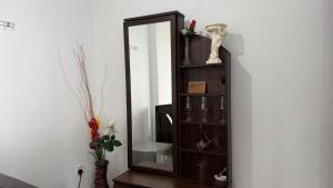 a mirror sitting on a shelf next to a wall at Hill Forest Cottage in Ella +63 photos