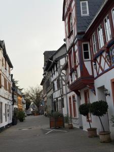 an empty street in a town with buildings at Tuvalu in Remagen