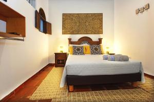 a bedroom with a large bed in a room at Casa Ruta Sur in Cali +22 photos