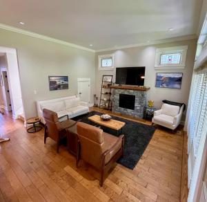 a living room with a couch and a fireplace at Qualicum Landing Paradise in Qualicum Beach