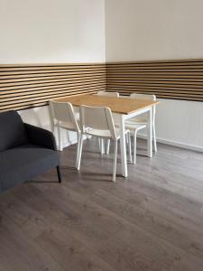 a wooden table and chairs in a room at Arcadia in Remagen