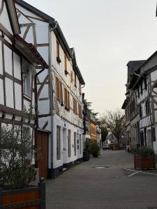 an empty street in a town with buildings at Arcadia in Remagen