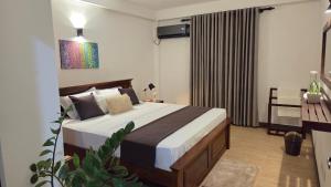 a bedroom with a large bed in a room at Casa Jose - 2BR with King Beds, Near Airport and Beach, 5G Wi-Fi in Wattala +41 photos