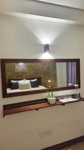 a bedroom with a bed with a large mirror at Casa Jose - 2BR with King Beds, Near Airport and Beach, 5G Wi-Fi in Wattala