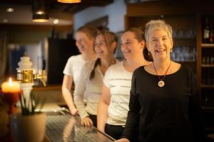 a group of women standing at a bar at Hotel Bischof in Schmallenberg