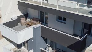 an overhead view of a building with chairs and tables at Olive Home in Alexandroupoli