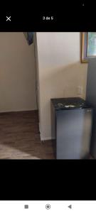 a picture of a room with a metal refrigerator at Habitaciones Bellavista 115 in Ciudad del Carmen