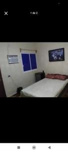 a picture of a bedroom with a bed and a window at Habitaciones Bellavista 115 in Ciudad del Carmen