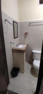 a bathroom with a sink and a toilet at Habitaciones Bellavista 115 in Ciudad del Carmen
