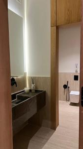 a bathroom with a sink and a toilet at اصيلة فيلا Asilah Villa in Buraydah +26 photos