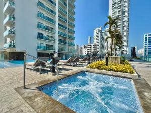 a hot tub on the patio of a building at Apartamento Special For You in Cartagena de Indias