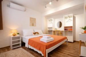 a white bedroom with a bed and a mirror at Kavala Hotel Bodrum in Bodrum City +49 photos