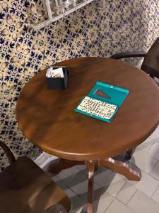 a wooden table with a computer keyboard on it at Borba Beach House in Recife