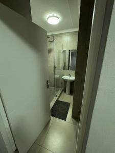 a bathroom with a shower and a toilet and a sink at Kheniyas Haven in Nelspruit +17 photos
