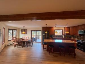 a kitchen and dining room with a table and chairs at Bayou Hills BnB in Parker