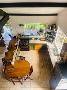 an overhead view of a kitchen with a table at Villa BOUDDHA- Raiatea in Uturoa +12 photos