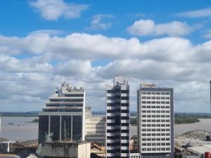 a group of tall buildings in a city at Céu Sol Sul in Porto Alegre