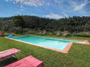 Piscina a Belvilla by OYO Podere Pulicciano Scaletta o a prop