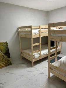 a room with two bunk beds in a room at Beit Shemesh gimmel apartment in Beit Shemesh