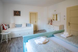 a bedroom with two beds and a dressing room at CHalupa Relax in Dolní Lomná