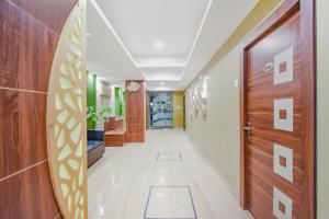 a hallway of a hospital with a door at Hotel O Tranquil Stay in Kolkata