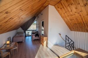 an overhead view of a living room with wooden ceilings at Lasosfera Lasówka in Lasowka