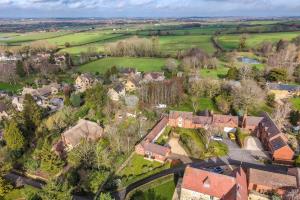 an aerial view of a village with houses and trees at Gleanings Cottage in Bredon +42 photos