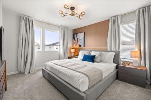 a bedroom with a large bed and a window at 16159Coastal in Clermont +32 photos