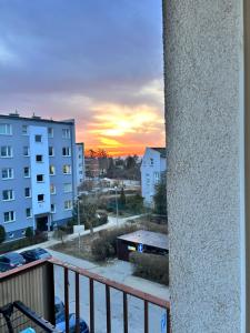 a view of a sunset from the balcony of a building at Sunset Studio in Kwidzyn
