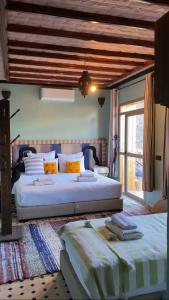 a bedroom with two beds in a room at Toubkal Ecolodge in Imlil +61 photos