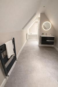 a bathroom with a sink and a mirror at 5 Bedroom Home Monaghan Town in Monaghan
