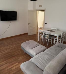 a living room with a couch and a table at SuiteMazzini in Lamezia Terme