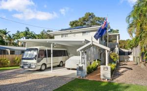 a white van parked in front of a house at Enchanted Garden, 3 bedrooms in Sandstone Point