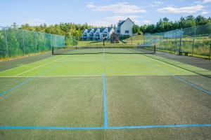 a tennis court with a net on top of it at Harbor Ridge in Southwest Harbor