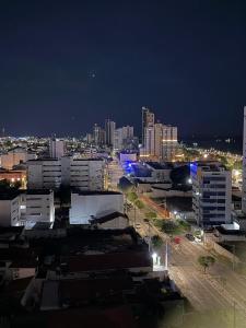 a city at night with buildings and street lights at Prime BNB 1005 Experiência Premium in Petrolina