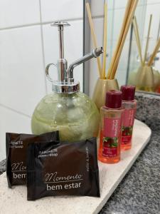 a counter with a soap dispenser and a bag of soap at Prime BNB 1005 Experiência Premium in Petrolina