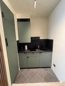 a small kitchen with a sink and a counter at GB home in Azzano San Paolo