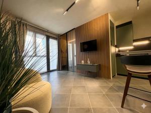 a living room with a couch and a tv at GB home in Azzano San Paolo
