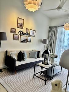 a living room with a couch and a table at daisy apartment taiping in Taiping