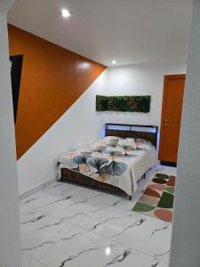 a bedroom with a bed in a room at Cozy renovated studio Comfort practicality in Bourgoin