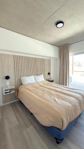 a large bed in a bedroom with a window at Almarena La Reserva UF 112 in Costa del Este +20 photos
