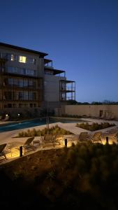a group of chairs sitting in front of a building at Almarena La Reserva UF 112 in Costa del Este