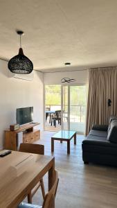 a living room with a couch and a table at Almarena La Reserva UF 112 in Costa del Este
